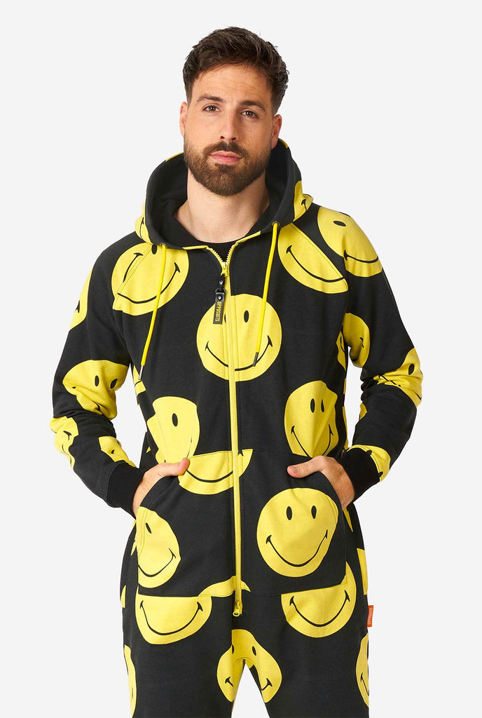 Man wearing black onesie with yellow smiley print