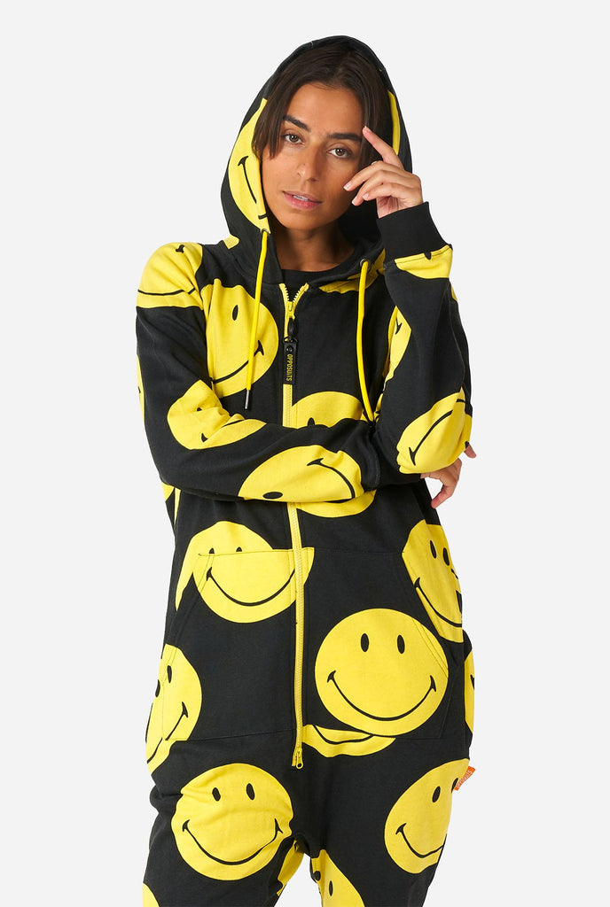 Man wearing black onesie with yellow smiley print
