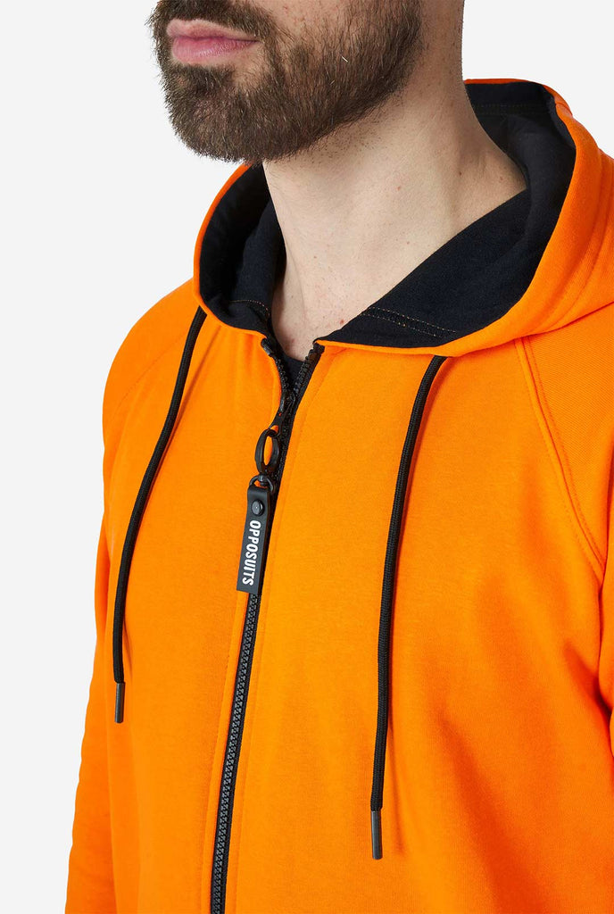 Man wearing orange onesie