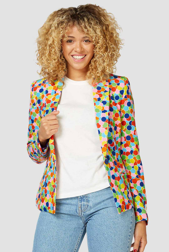 Multicolor confetti print blazer worn by a woman zoomed in