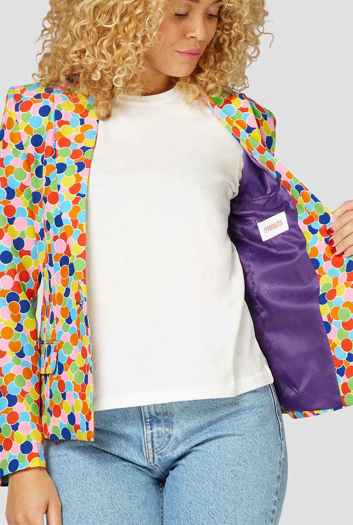 Multicolor confetti print blazer worn by a woman zoomed in