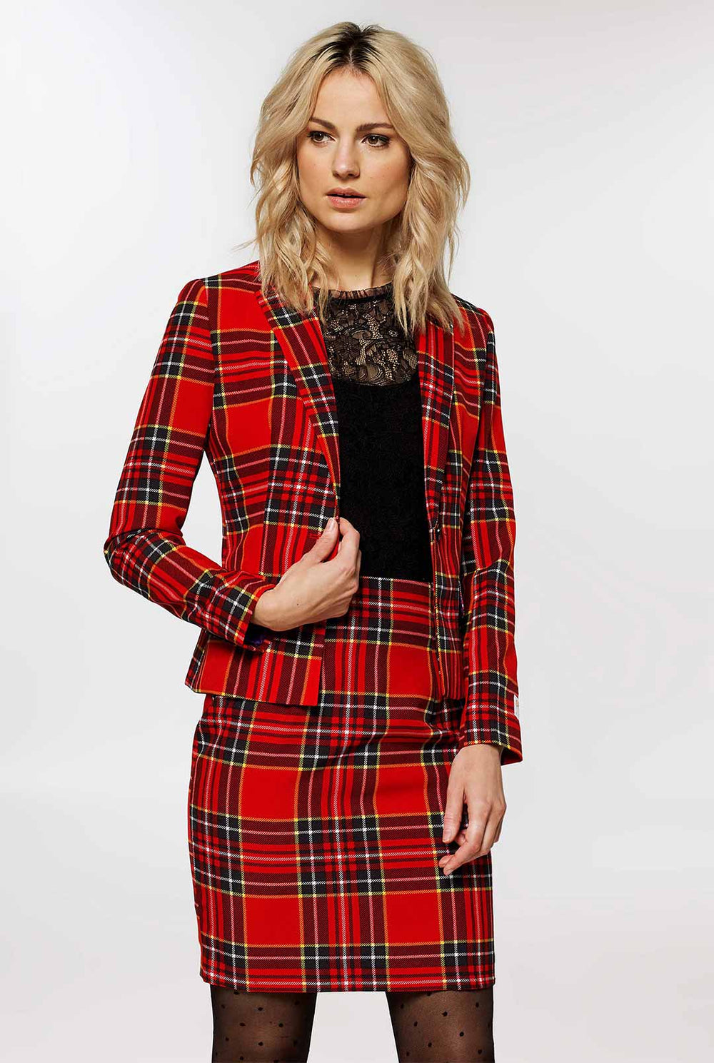 Woman wearing red tartan Christmas suit