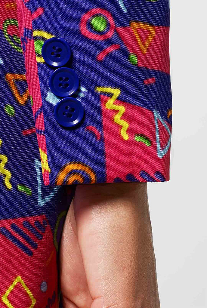 Woman wearing pink and purple suit with retro print