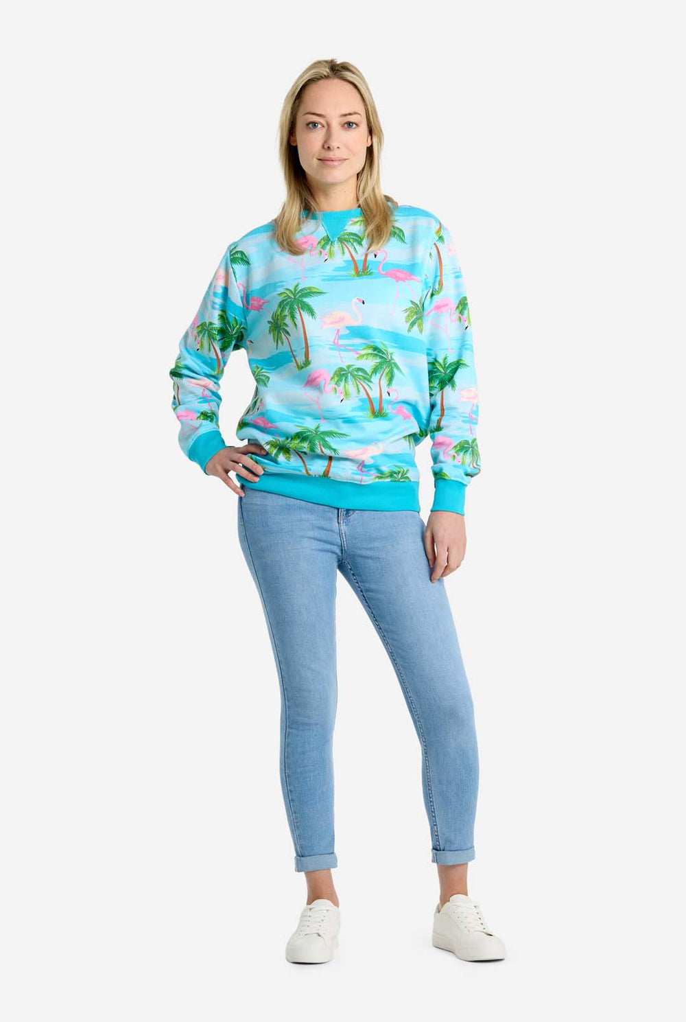 Man wearing blue sweater with tropical flamingo print