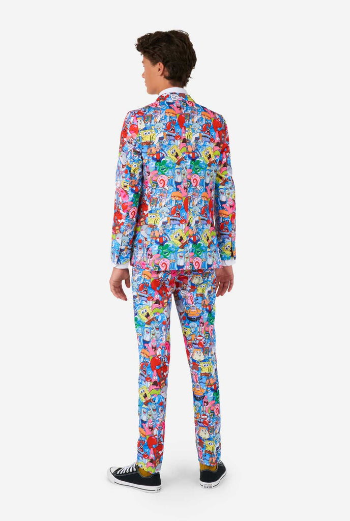 Teen wearing suit with Spongebob print, view from the back