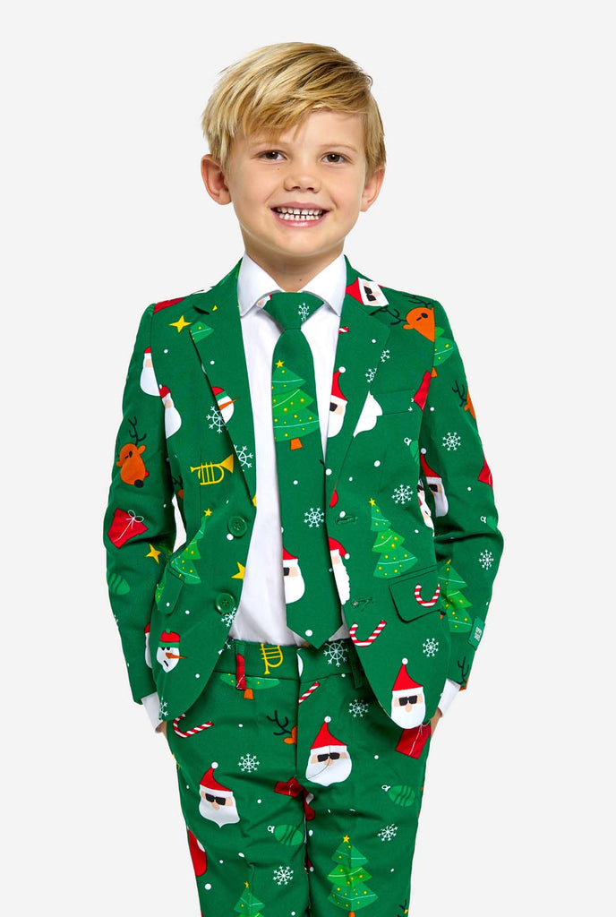 Boy wearing green Christmas suit for kids, with Christmas icons.