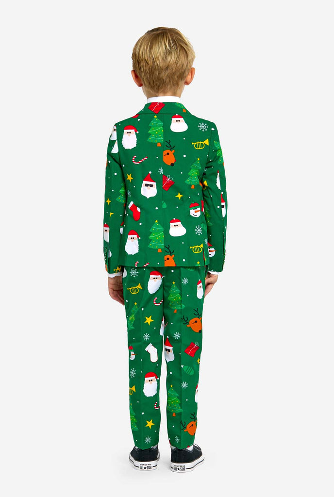 Boy wearing green Christmas suit for kids, with Christmas icons, view from the back