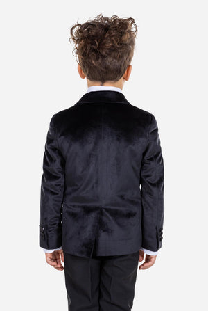 Kid wearing black velvet dinner jacket for boys. View from the back.