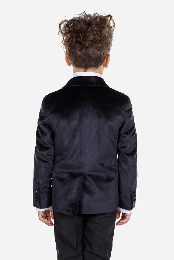 Kid wearing black velvet dinner jacket for boys. View from the back.