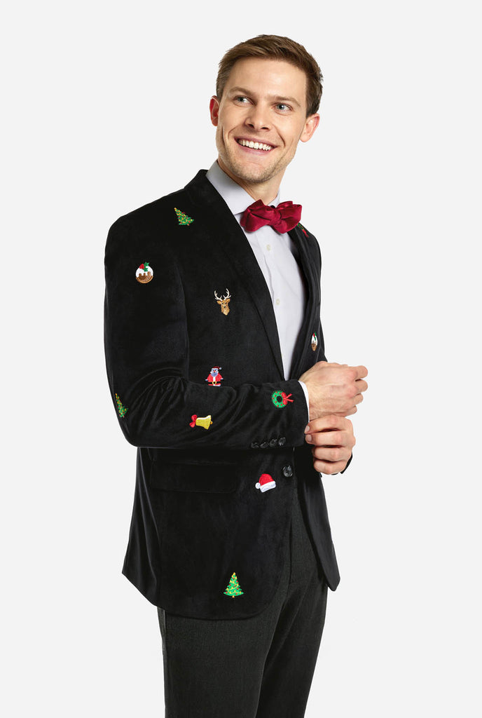 Man wearing burgundy red velvet Christmas blazer with Christmas icons