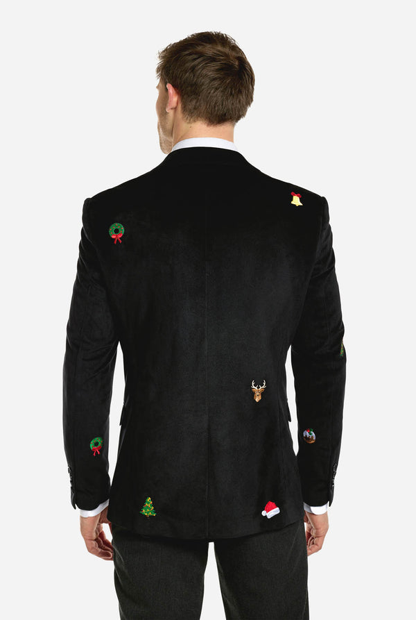 Man wearing burgundy red velvet Christmas blazer with Christmas icons, view from the back