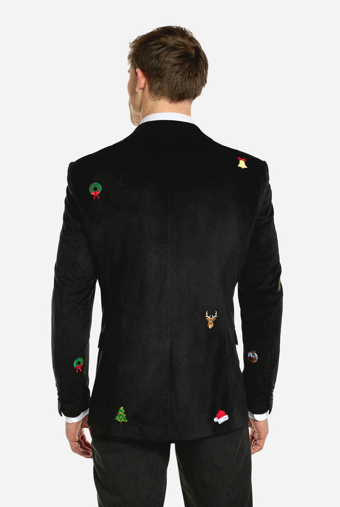 Man wearing burgundy red velvet Christmas blazer with Christmas icons, view from the back