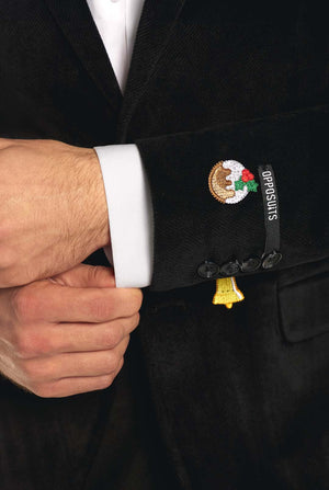 Man wearing burgundy red velvet Christmas blazer with Christmas icons, close up