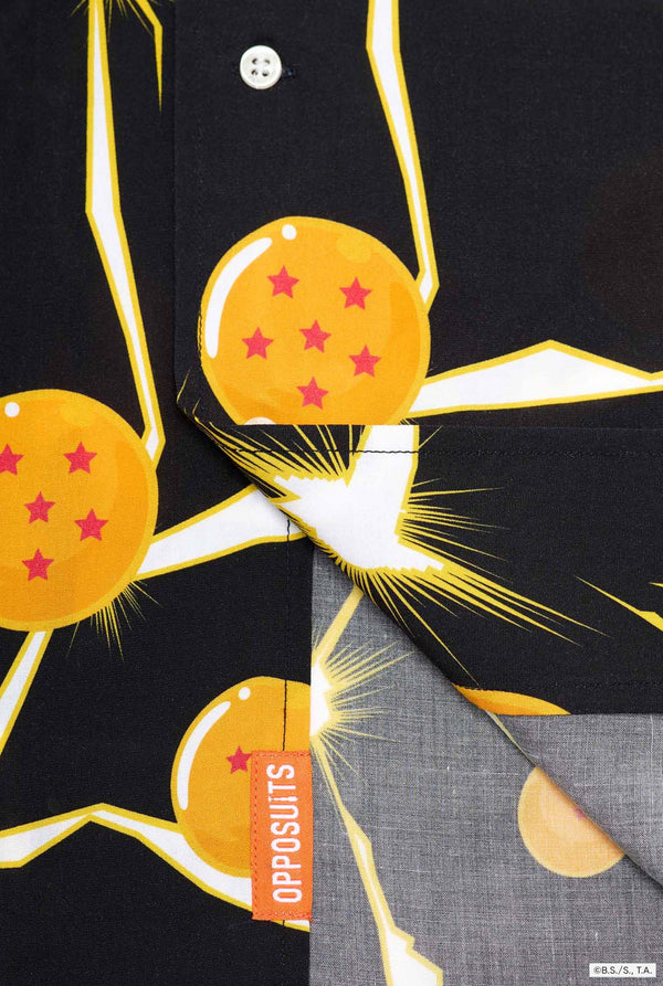 Image of black Hawaiian shirt with Dragon Ball Z print, showing Dragon Balls and lightning. Close-up button closure bottom of the shirt.