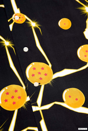 Image of black Hawaiian shirt with Dragon Ball Z print, showing Dragon Balls and lightning. Close-up of the button closure.