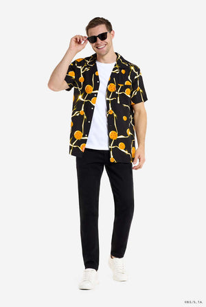 Man wearing black Hawaiian shirt with Dragon Ball Z print, showing Dragon Balls and lightning. He is also wearing a white t-shirt, black pants and sunglasses.
