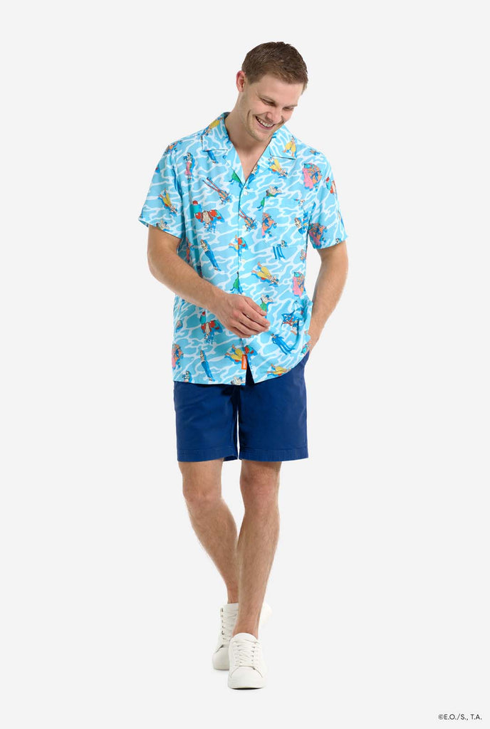 Man wearing blue Hawaiian shirt with One Piece character print. Full body image.