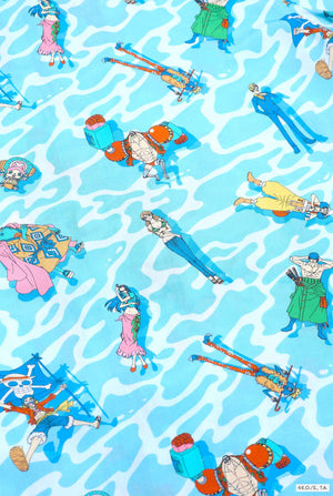 Blue Hawaiian shirt with One Piece character print. Close up.