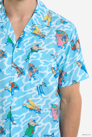 Man wearing blue Hawaiian shirt with One Piece character print. Chest close up.
