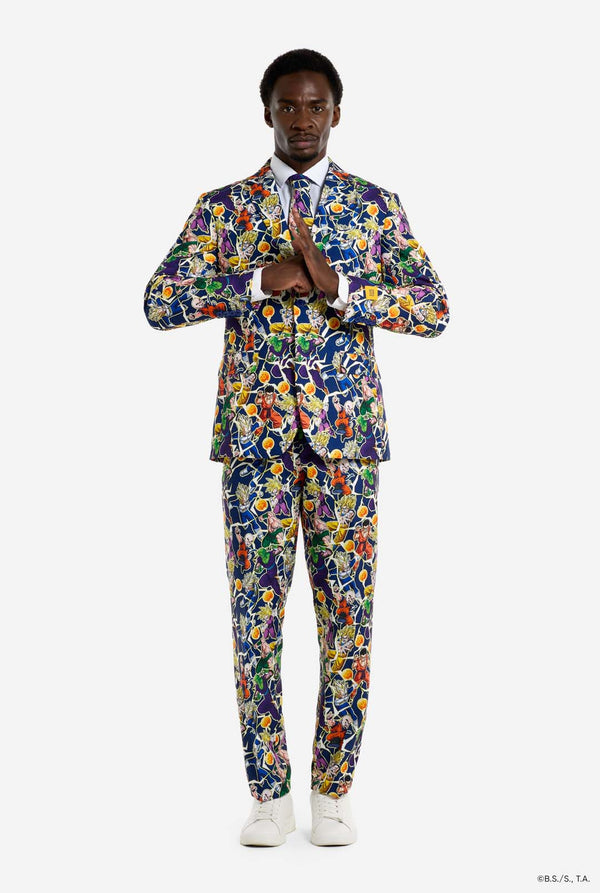 Man wearing all over print men's suit with Dragon Ball Z print which shows the Dragon Ball characters. Suit consists of Blazer, pant and tie. Full body image.