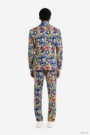Man wearing all over print men's suit with Dragon Ball Z print which shows the Dragon Ball characters. Suit consists of Blazer, pant and tie. View from the back.