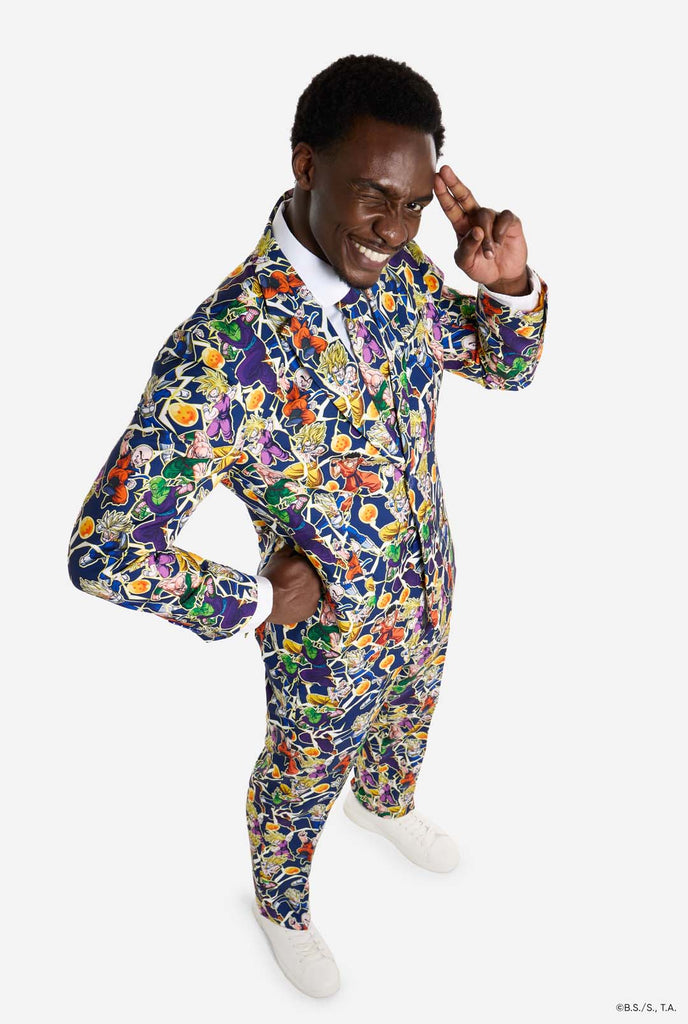 Man wearing all over print men's suit with Dragon Ball Z print which shows the Dragon Ball characters. Suit consists of Blazer, pant and tie. Image from above.