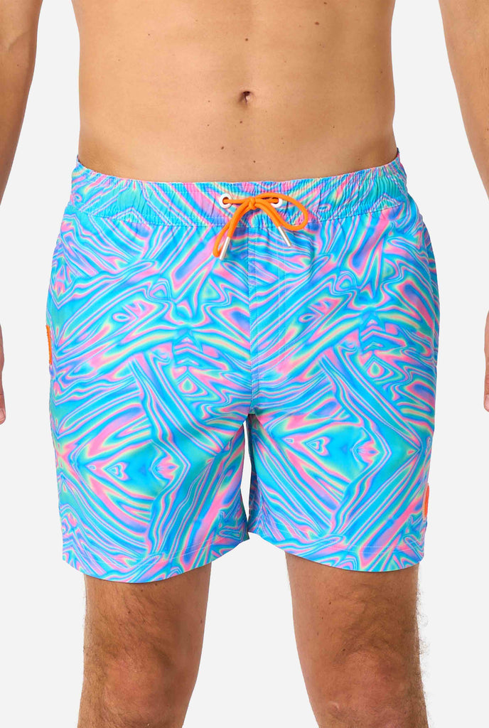 Men's vibrant holographic swim shorts with a mesmerizing blue, pink, and purple swirl design. Eye-catching and stylish swimwear for summer fun.