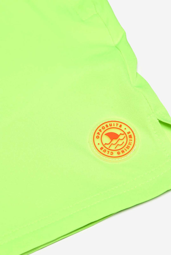 Man wearing Neon lime green swim trunks for men, close up