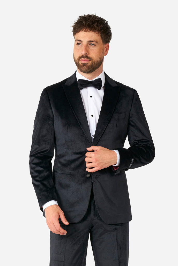 Man wearing black velvet tuxedo