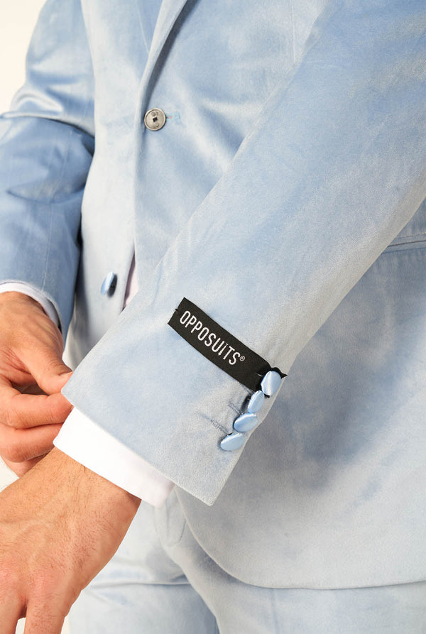Man wearing blue velvet tuxedo, sleeve close up