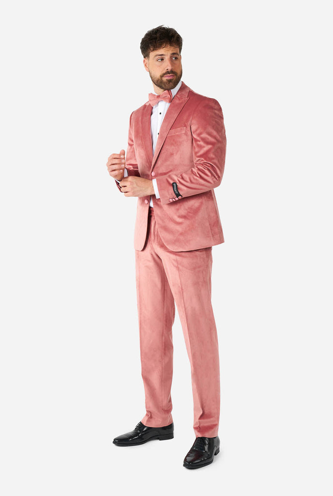Man wearing pink velvet tuxedo