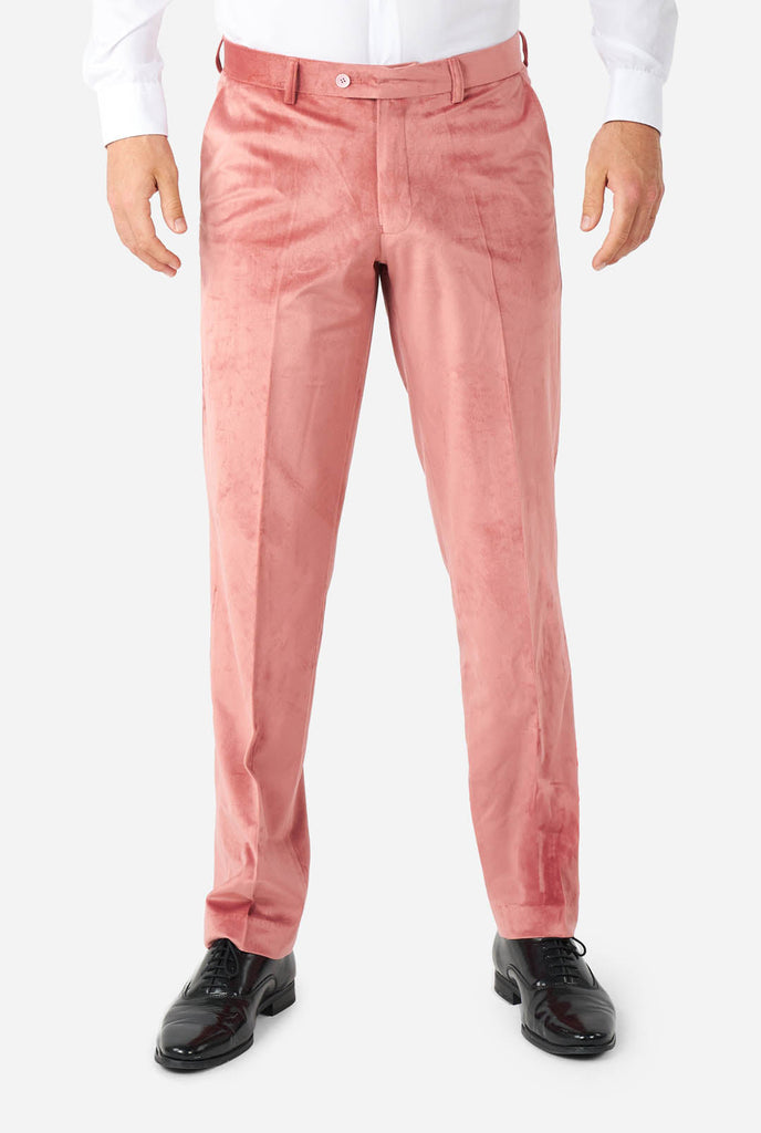 Man wearing pink velvet tuxedo, pants view
