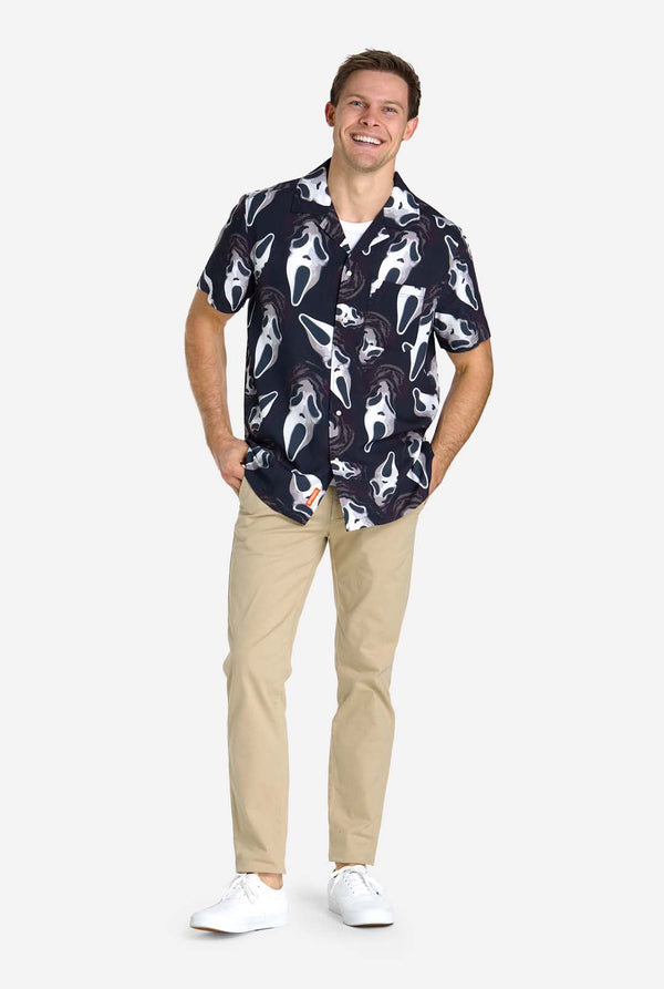 Man wearing black Hawaiian shirt with Ghostface print