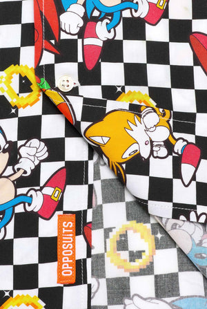 Close up of a black and white checkered Hawaiian shirt with characters from the Sonic the Hedgehog franchise and golden rings on it. Showing the bottom part of the shirt.