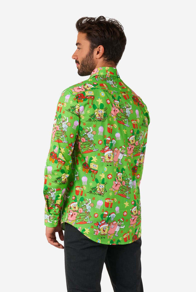 Man wearing green Christmas themed Men's Shirt Spongebob shirt, view from the back
