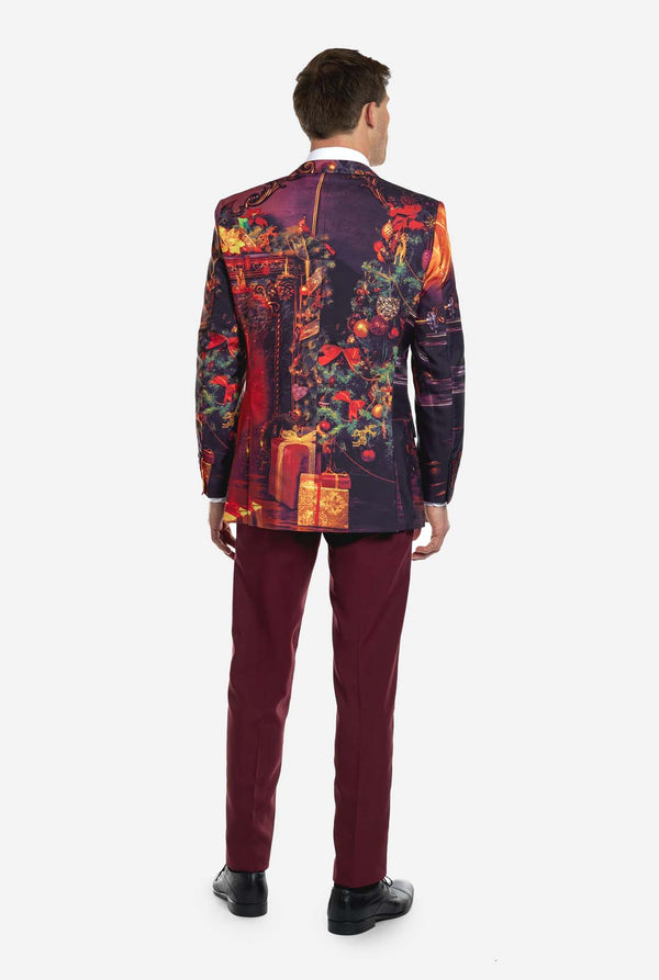 Man wearing burgundy red Christmas suit with vintage Christmas print, view from the back