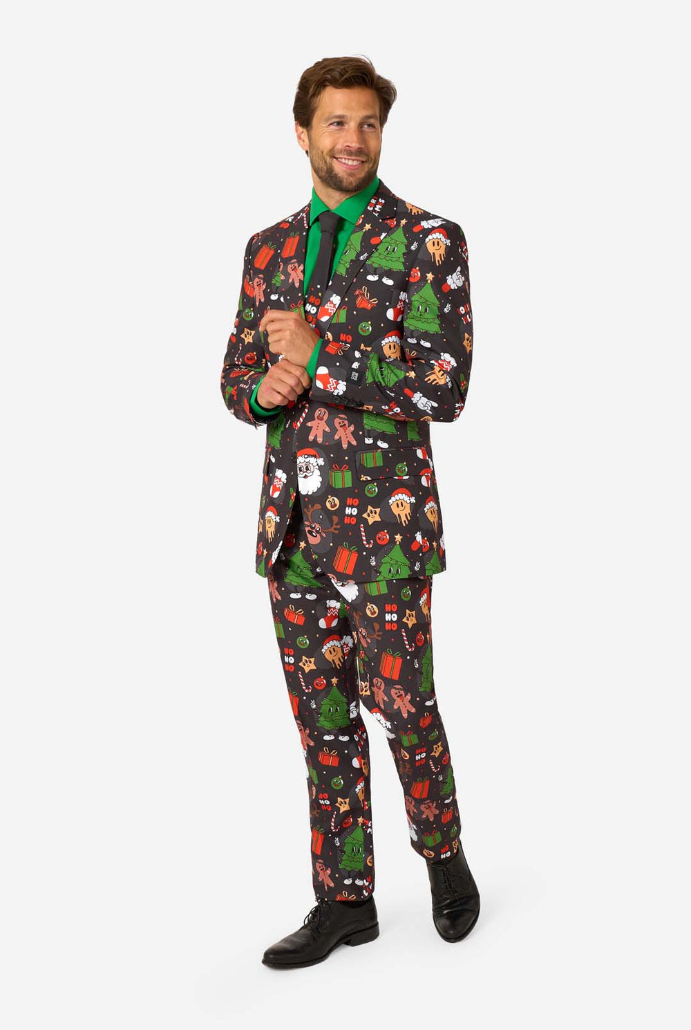 Man wearing a festive suit with Christmas-themed patterns on a white background