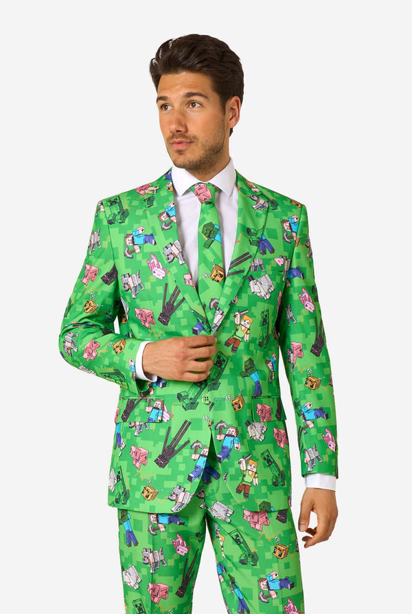 Man wearing a bright green Minecraft suit with iconic characters, including Creepers and Steve – full view from the front.