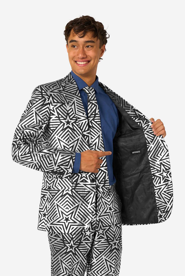 Close-up of man opening his jacket to reveal black inner lining with OppoSuits logo, showcasing the suit's interior design.
