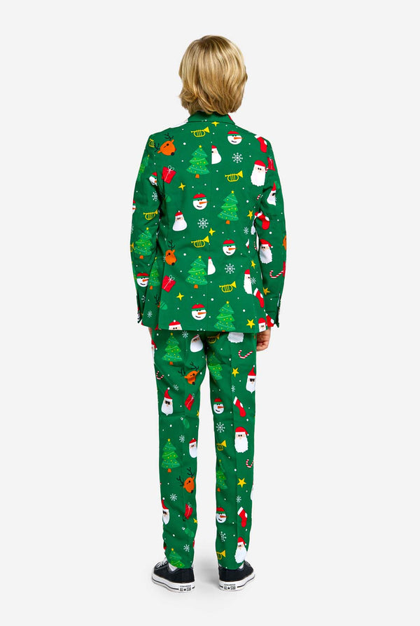 Teen wearing green Christmas suit for teens, with Christmas icons.