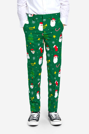 Teen wearing green Christmas suit for teens, with Christmas icons.