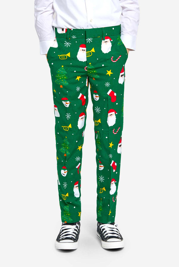 Teen wearing green Christmas suit for teens, with Christmas icons.