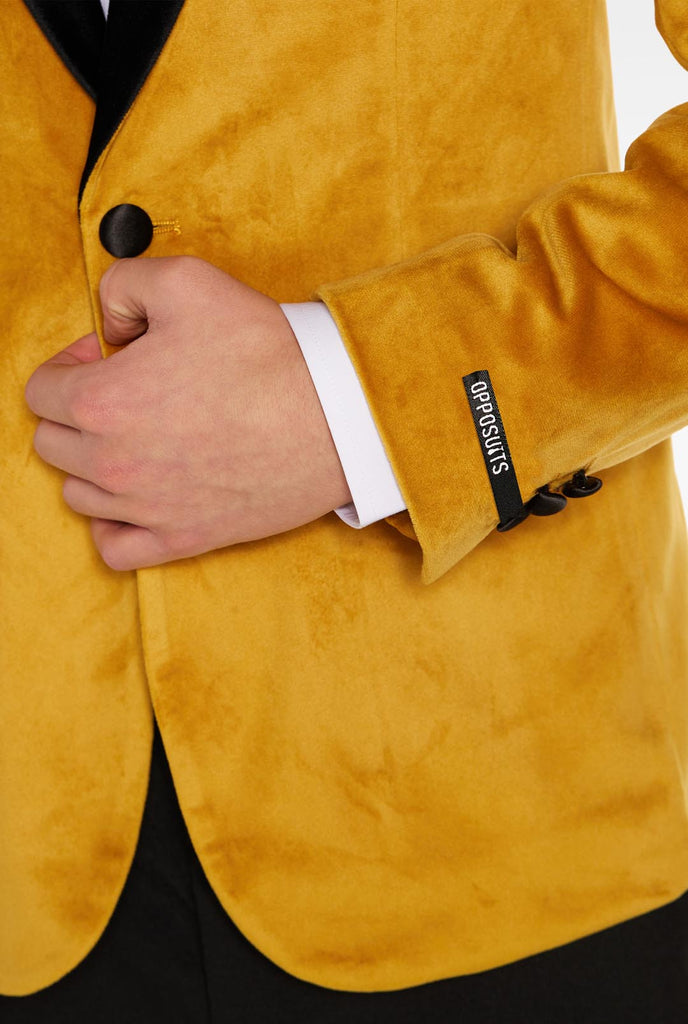 Teen wearing golden velvet dinner jacket