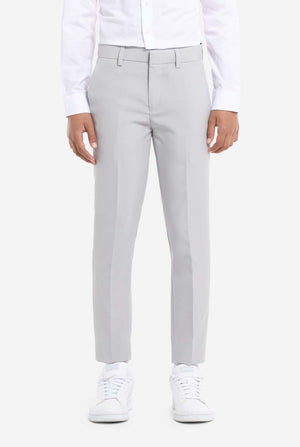 Teen wearing grey formal suit, pants view