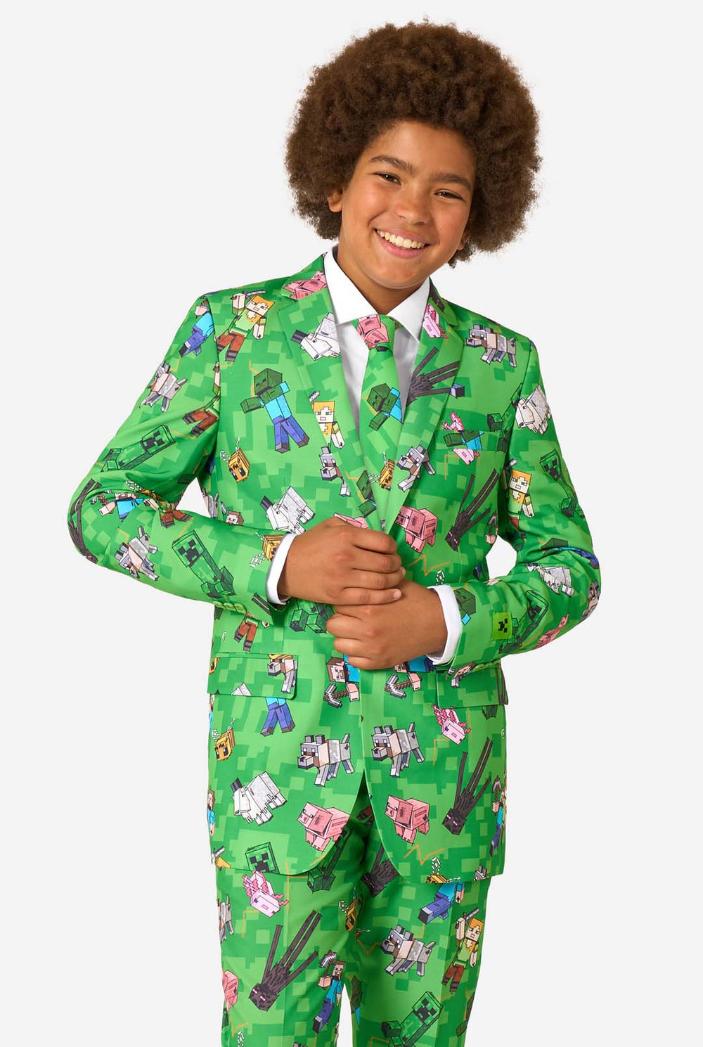 Teen boy wearing a bright green Minecraft suit with iconic characters, including Creepers and Steve – full view from the front.