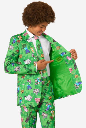 Teen boy wearing a bright green Minecraft suit with iconic characters, including Creepers and Steve – Holding his jacket open