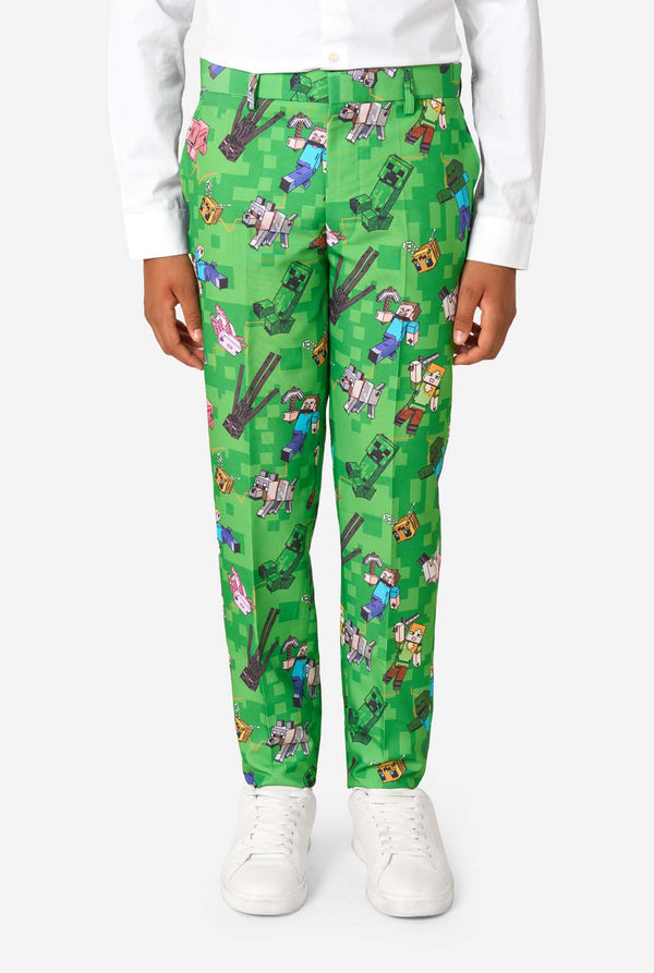 Teen boy wearing a bright green Minecraft suit with iconic characters, including Creepers and Steve – Close up of the pants