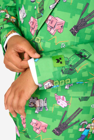 Teen boy wearing a bright green Minecraft suit with iconic characters, including Creepers and Steve – Close up of the sleeves