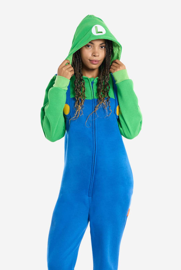Woman wearing unisex adult onesie with Luigi print