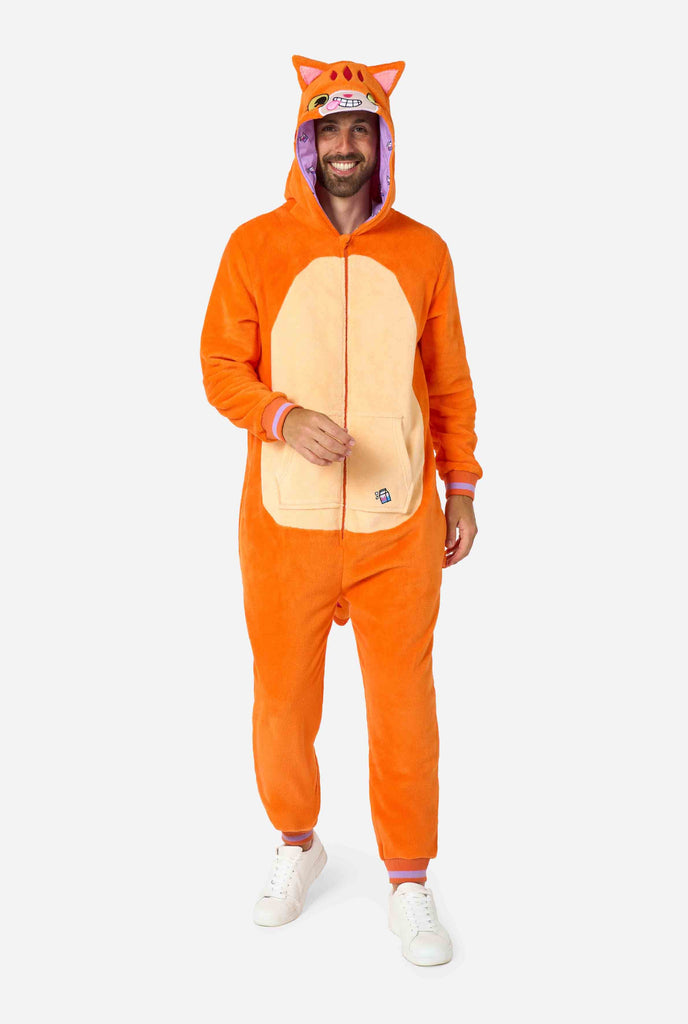 A smiling man is wearing an orange adult onesie designed as a red cat onesie. The onesie features a hood resembling a cat's head, and cat details, perfect for cozy lounging or costume parties. Full body image.
